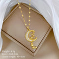 Stainless steel moon tassel necklace with geometric copper pendant and diamond detailing
