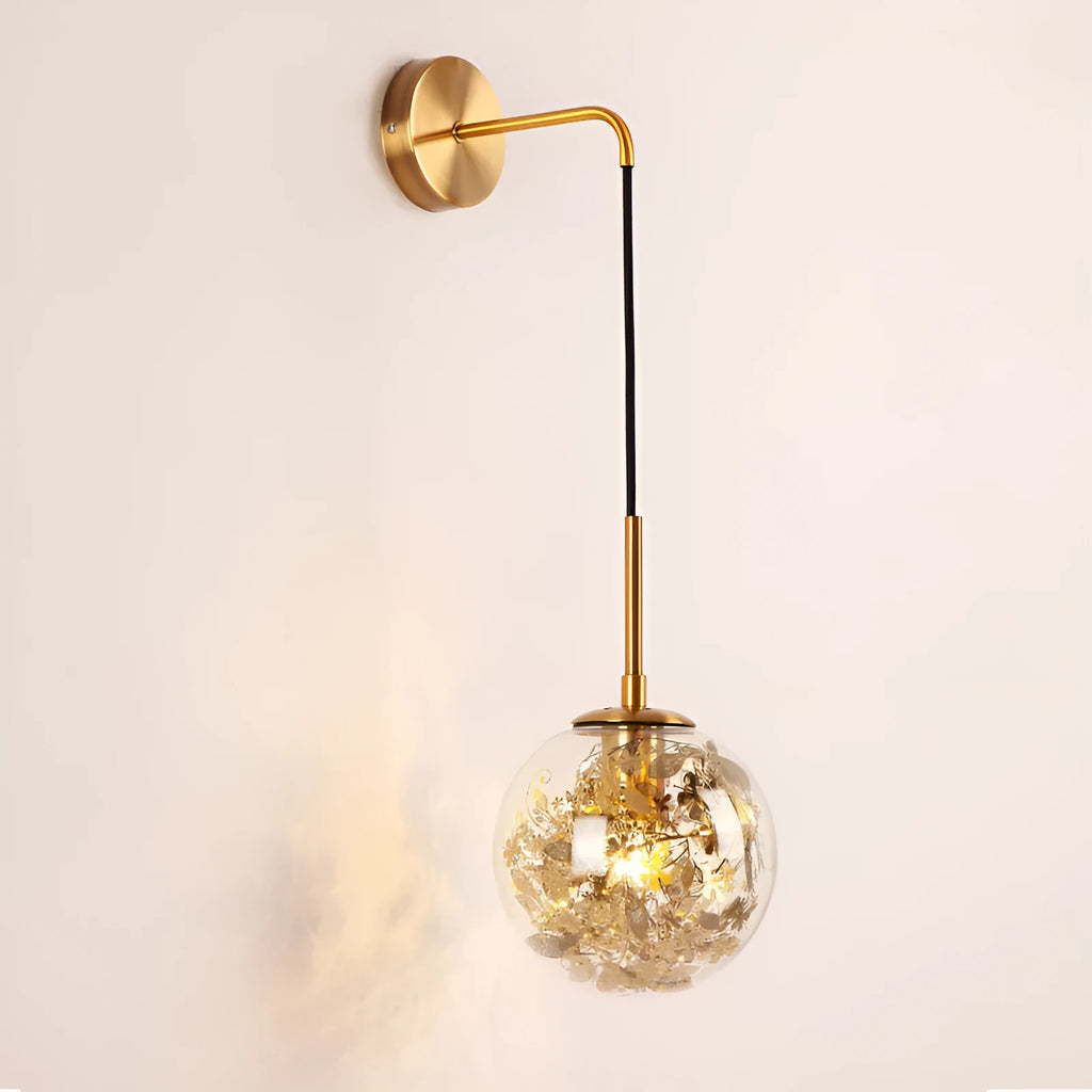 Modern glass wall lamp with metallic finish mounted beside bed for bedside lighting