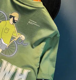Green loose fit men's short sleeve t-shirt with a printed design on the front.