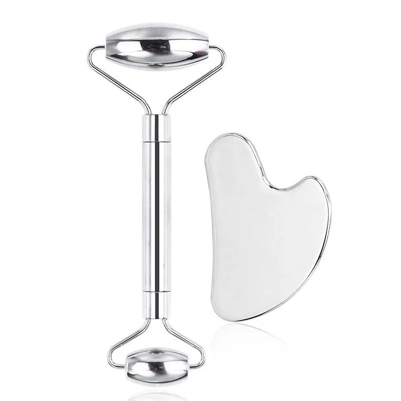 Stainless steel facial massage board with double-head roller, scraping plate, and heart-shaped eye poking stick