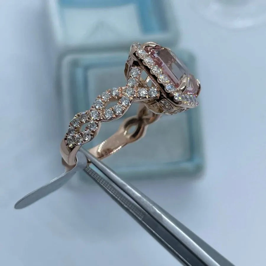Geometric design rose gold alloy ring on a grey background, showing its clean lines and metallic finish.