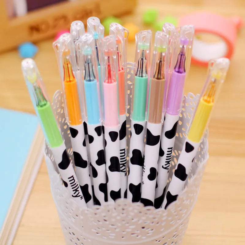 Box of twelve cow print patterned gel pens with 0.38mm fine tips in assorted colours.
