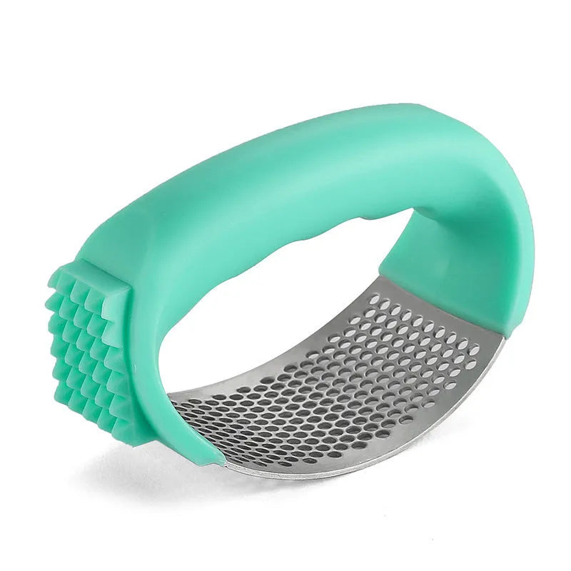 304 stainless steel garlic press in green colour showing modern simplicity design