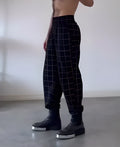 Men's plaid trousers with apron-style front panel in casual style