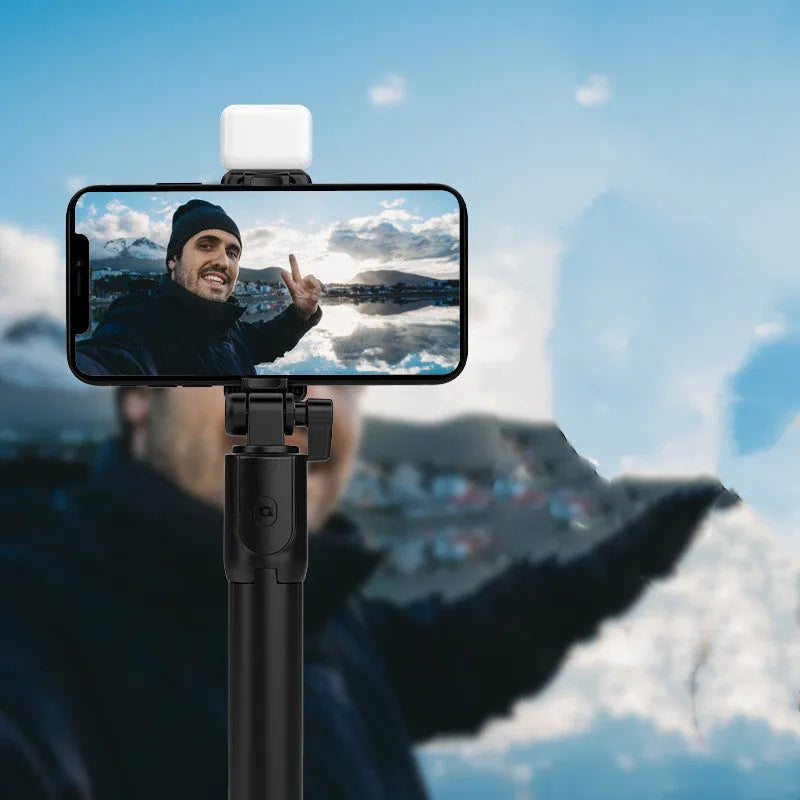 Aluminium Bluetooth selfie stick and tripod with phone holder in black, extended for use.