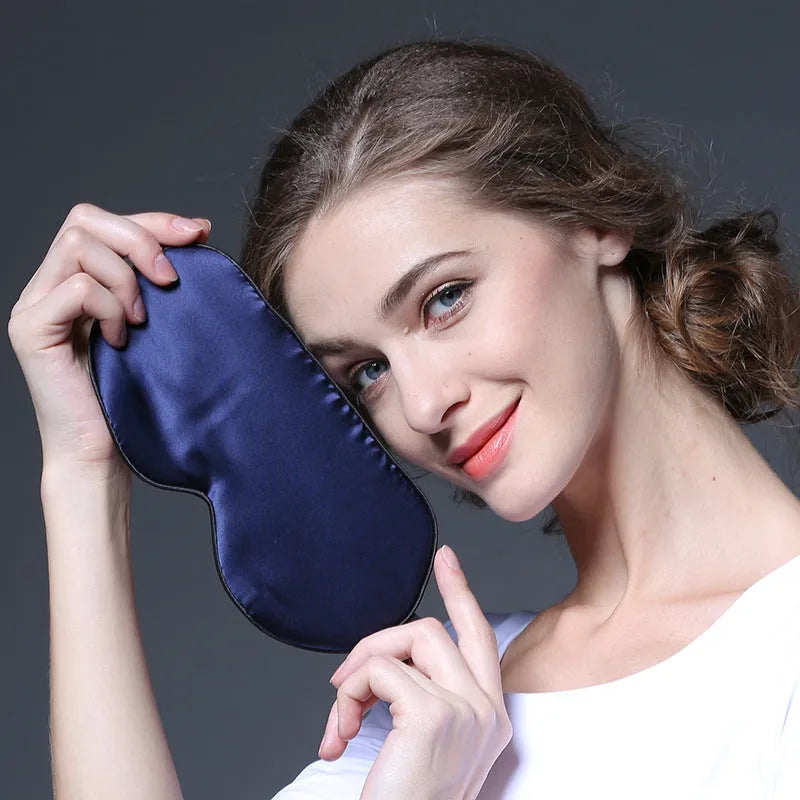 Double-sided mulberry silk sleep eye mask with embroidered printed pattern in various colours.