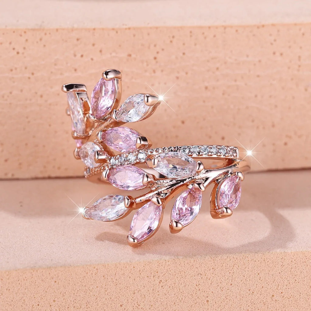 Adjustable horse eye zircon leaf ring in rose gold or platinum plating on a model's hand.