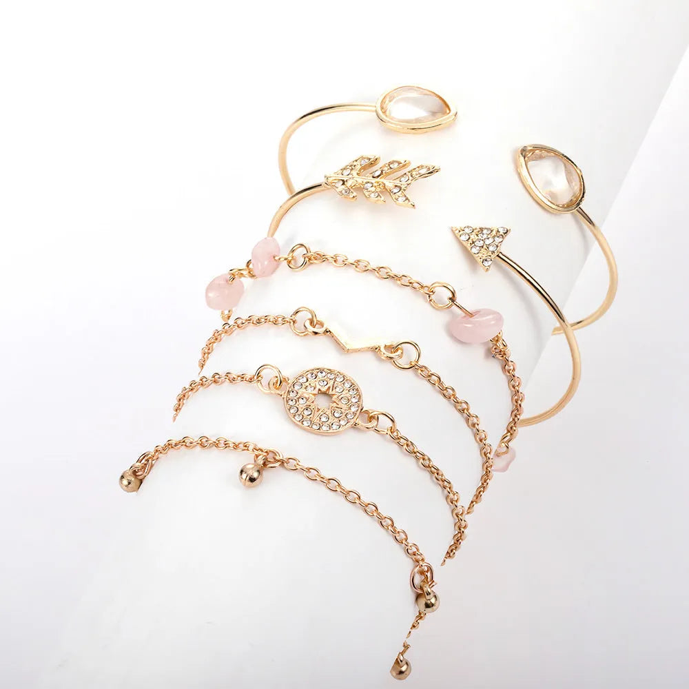 Golden spot finish zinc alloy bracelet set with six pieces featuring arrow, water drop and V-shaped geometric designs