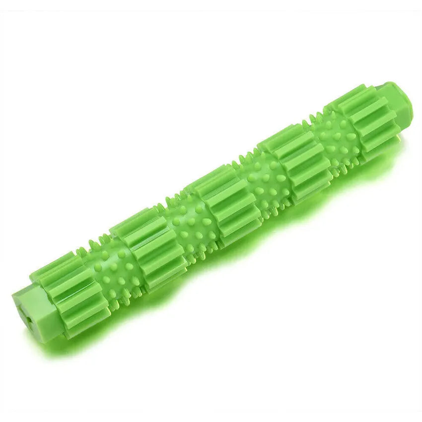 Green and orange durable rubber dog chew toy with textured surface and treat dispensing hole.
