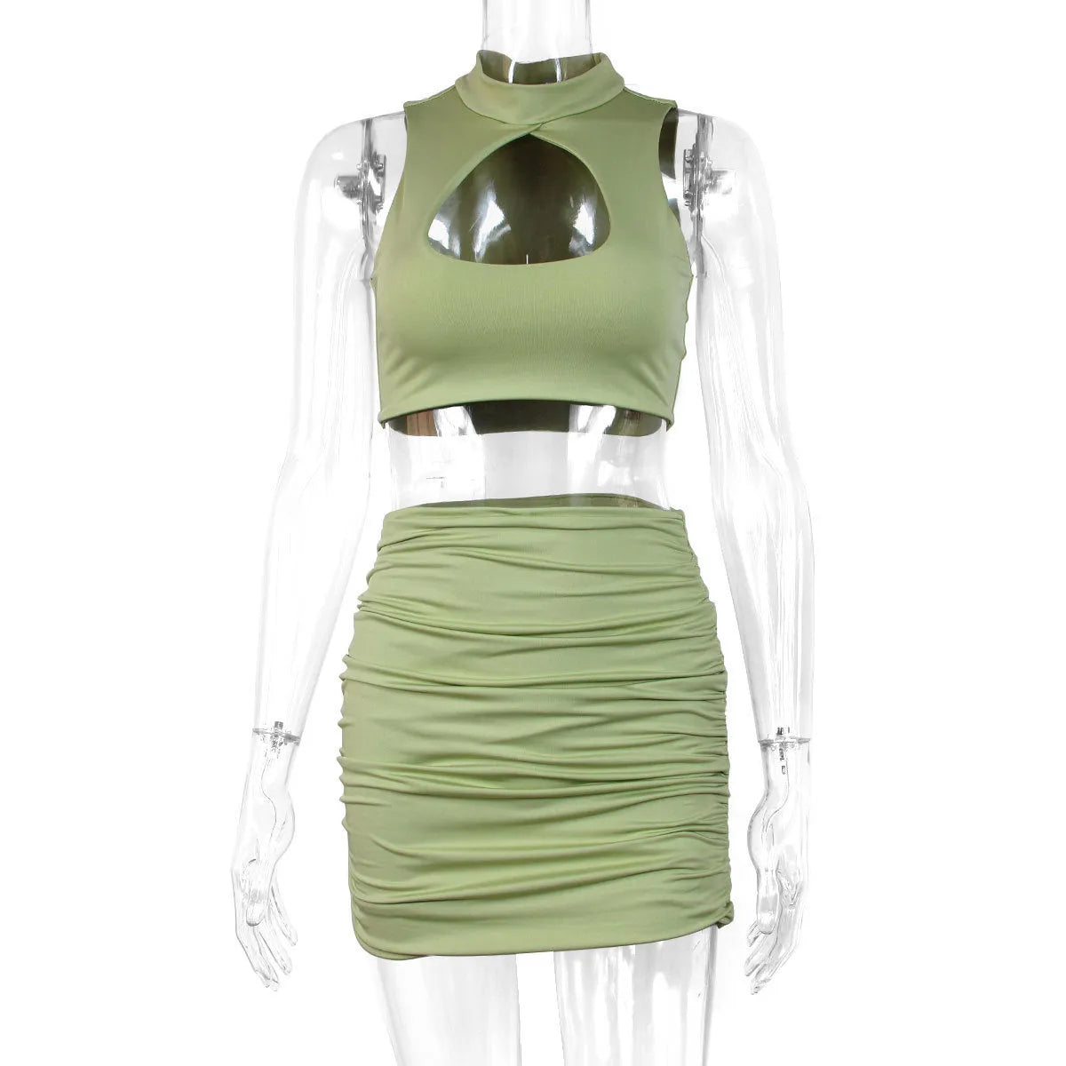 Women's light purple two-piece set with hollow vest top and split skirt on a model.