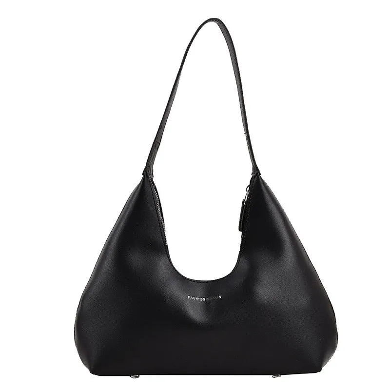 Retro style PU shoulder handbag in pillow shape with single strap and internal organisation pockets