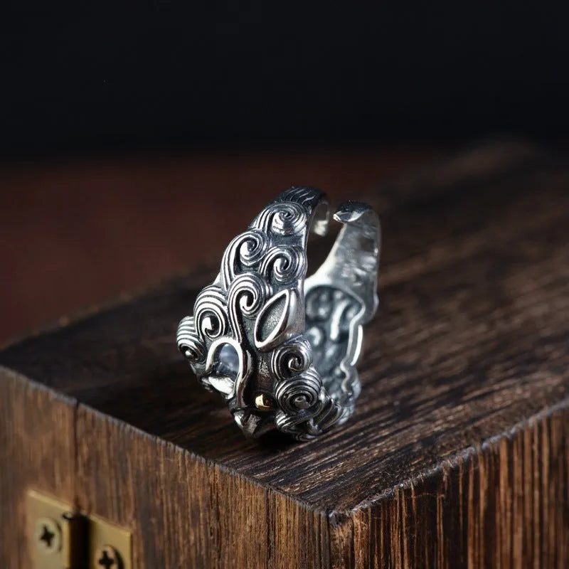 Sterling silver open ring showing animal or zodiac pattern detail with adjustable design