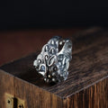 Sterling silver open ring showing animal or zodiac pattern detail with adjustable design