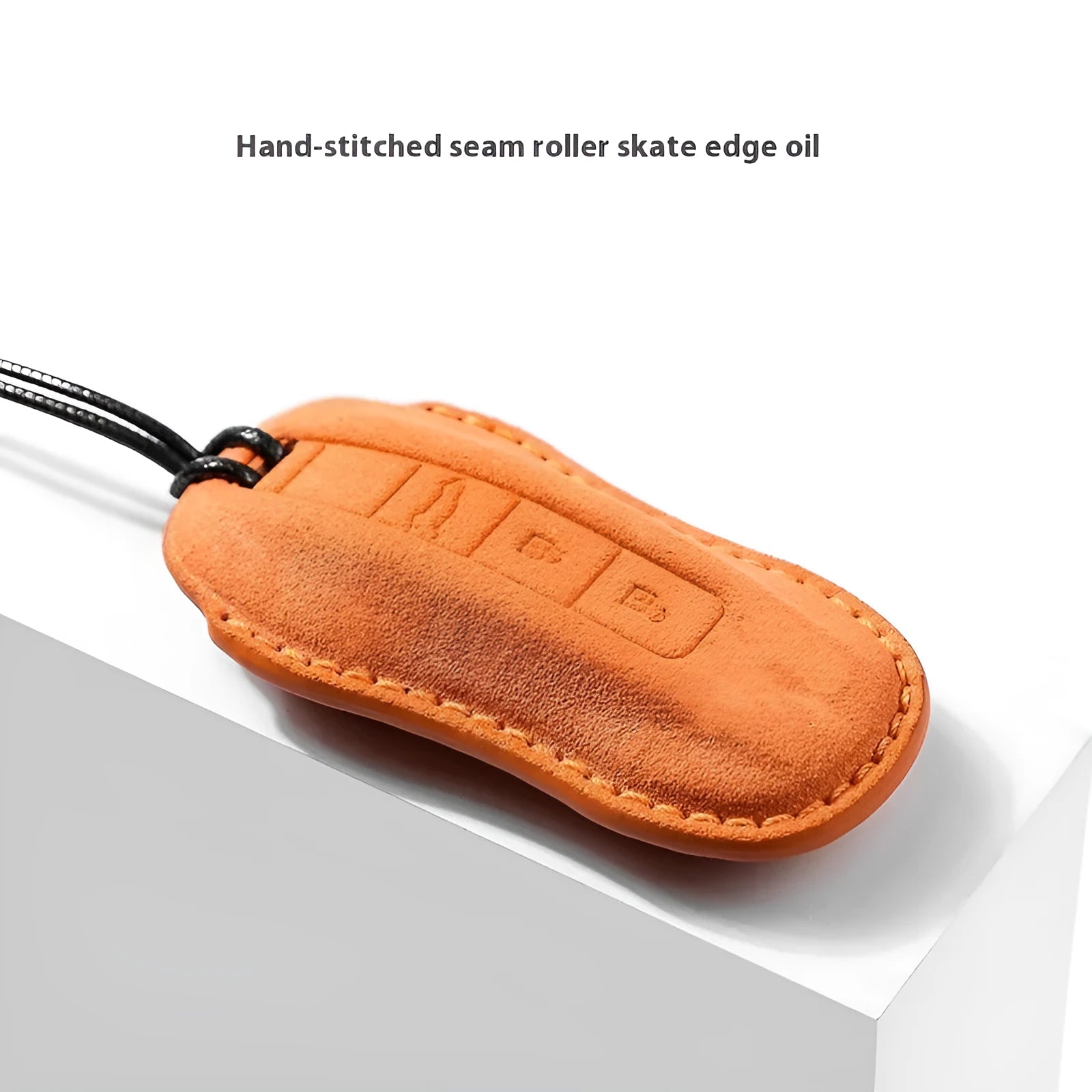 Suede car key cover in cement grey, dark green, light grey, and orange colour options