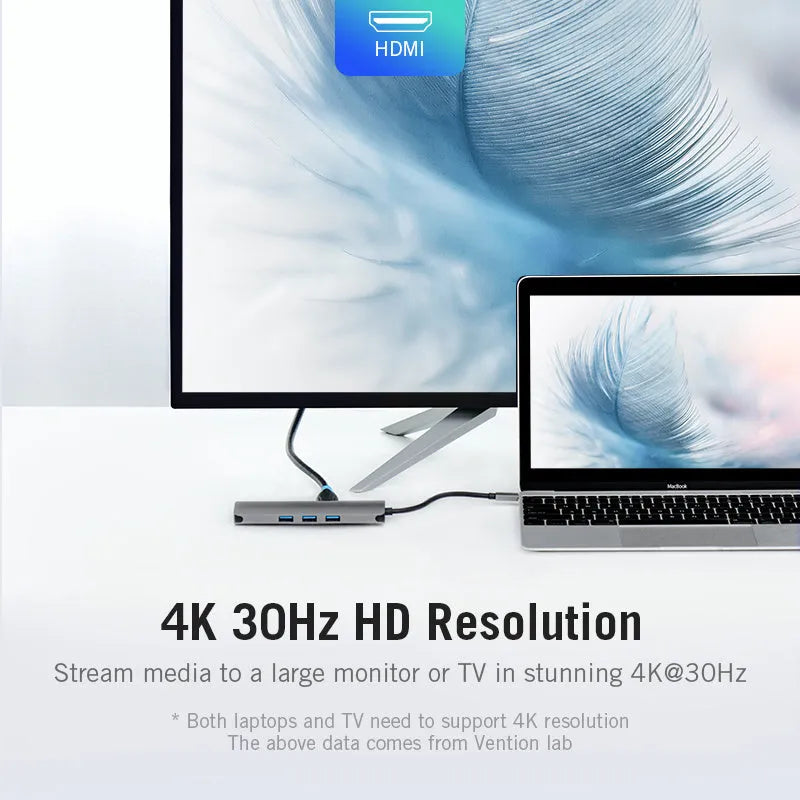 Deep grey USB-C to 6-in-1 hub showing HDMI, USB, Ethernet, SD, and TF card ports on a slim aluminium body.