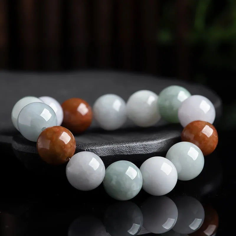 Natural Myanmar jade bracelet with three colours on 13mm round beads showing traditional craftsmanship