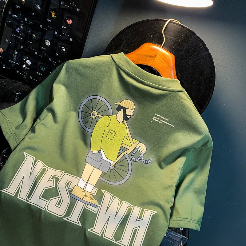 Green loose fit men's short sleeve t-shirt with a printed design on the front.