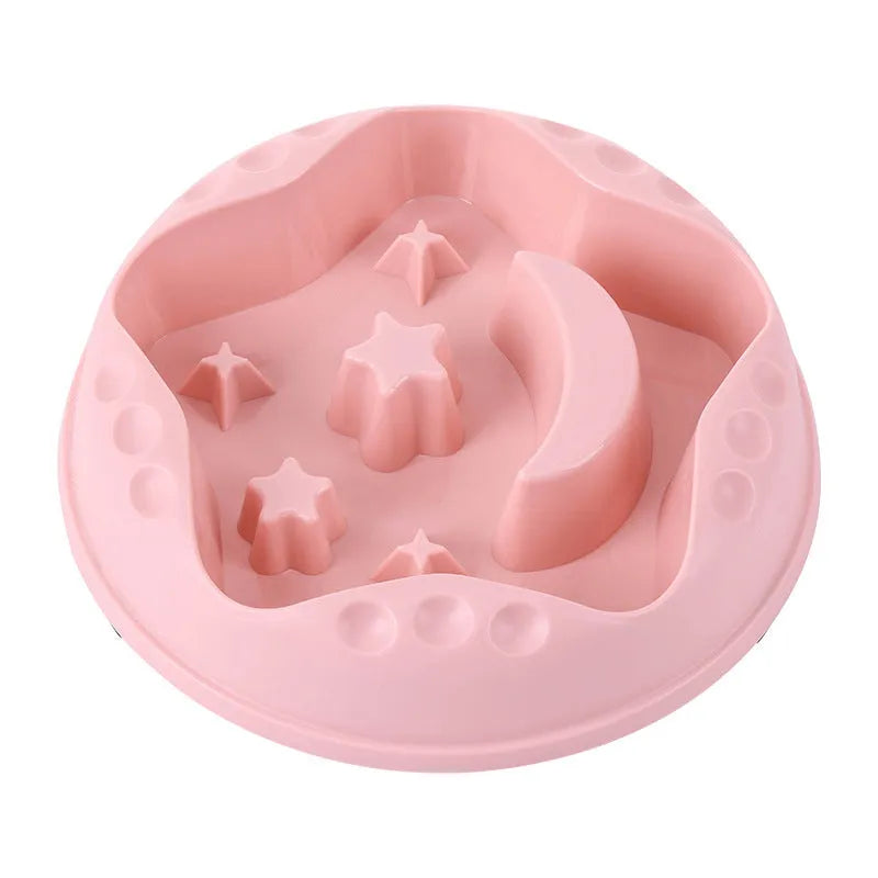 Blue plastic slow feeder dog bowl with moon, star, and wing-shaped interior ridges