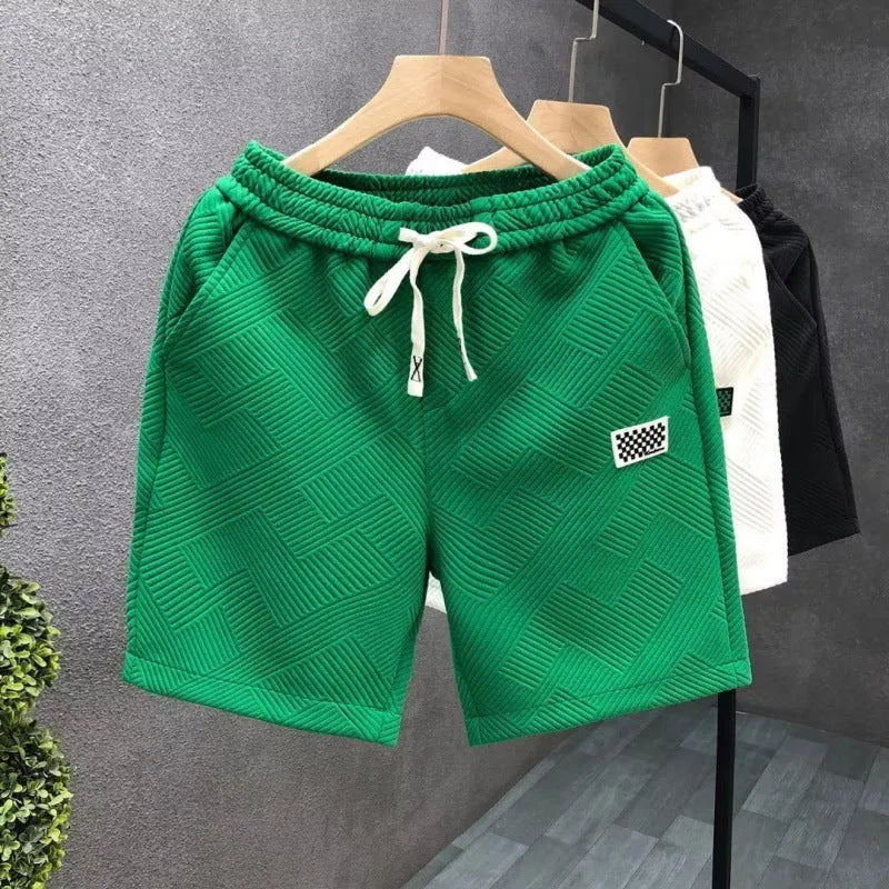 Micro-elastic polyester sports shorts in white, black and green colours for beach and casual wear