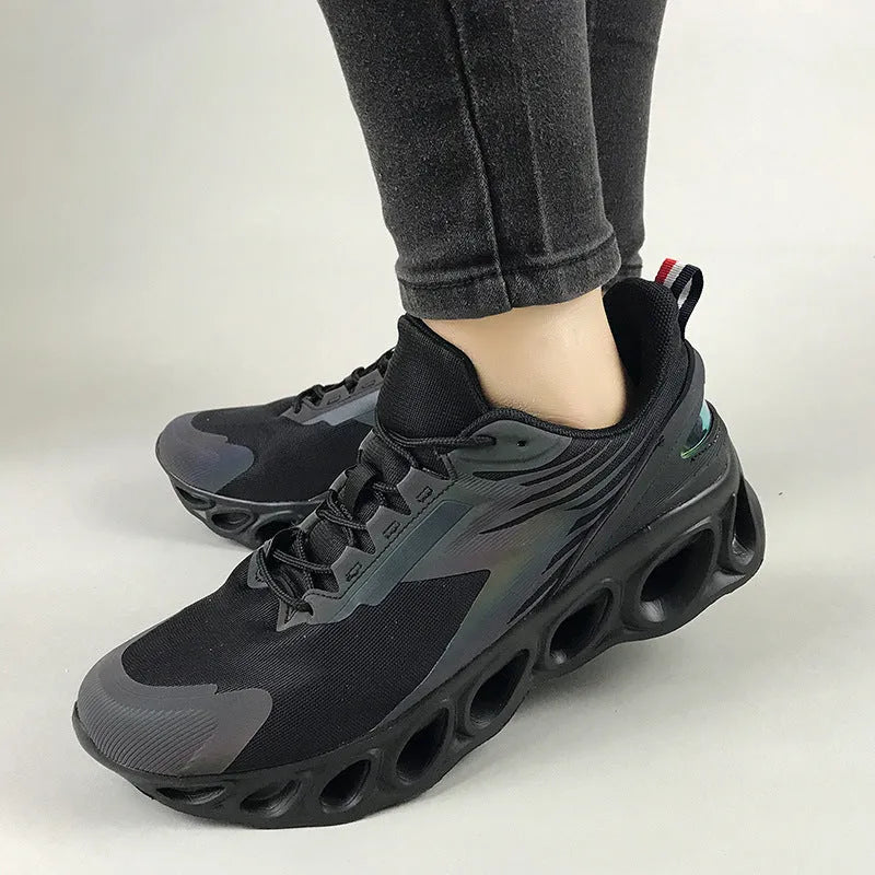 Breathable low-top mesh casual trainers in black on a white background, showing lace-up front and round toe.