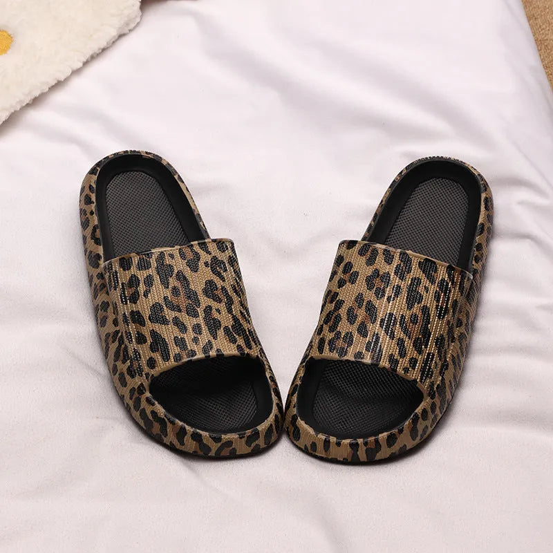 Women's leopard print slippers with thick EVA sole in black, pink, khaki, and white zebra print.