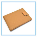 Dark grey felt clamshell laptop bag open to show internal compartment for a tablet