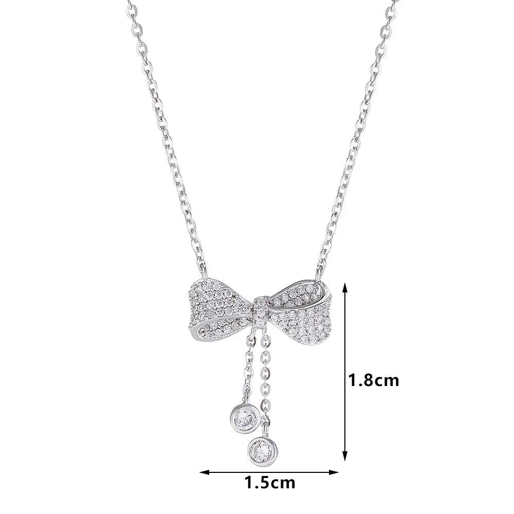 Sterling silver bow pendant necklace on O-ring chain with adjustable 40-45cm length