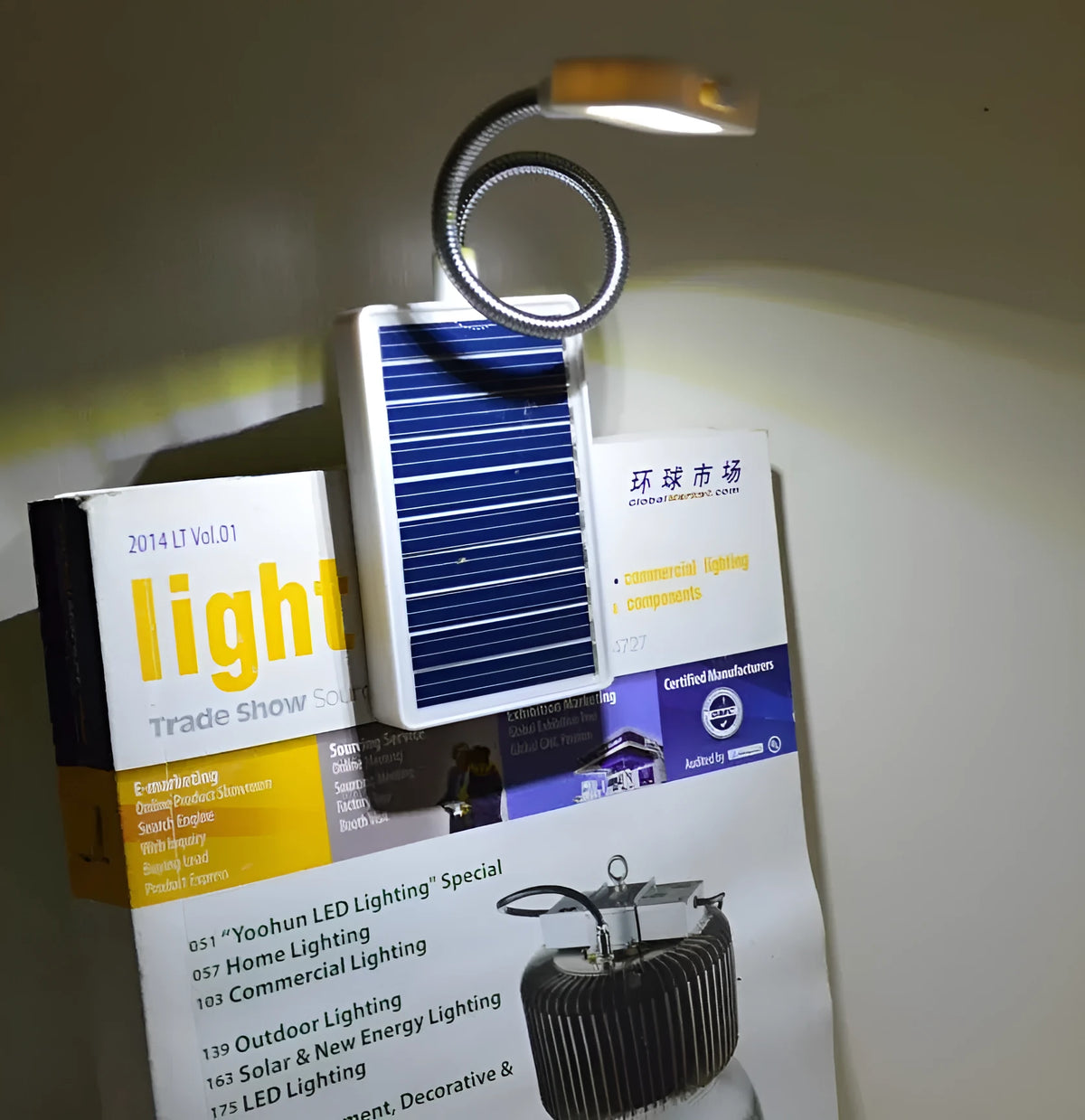 Solar LED lamp with plastic lampshade, button switch, and built-in lithium battery, charged by solar or USB.