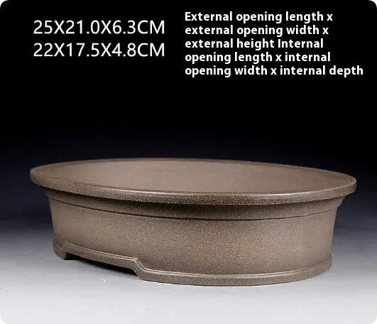 Handmade purple sand ceramic bonsai pot with antique oval design measuring 25x21x6.3cm