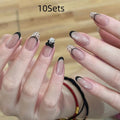 Five sets of short square shaped press-on fake nails with a peel-and-stick backing, shown in assorted colours.