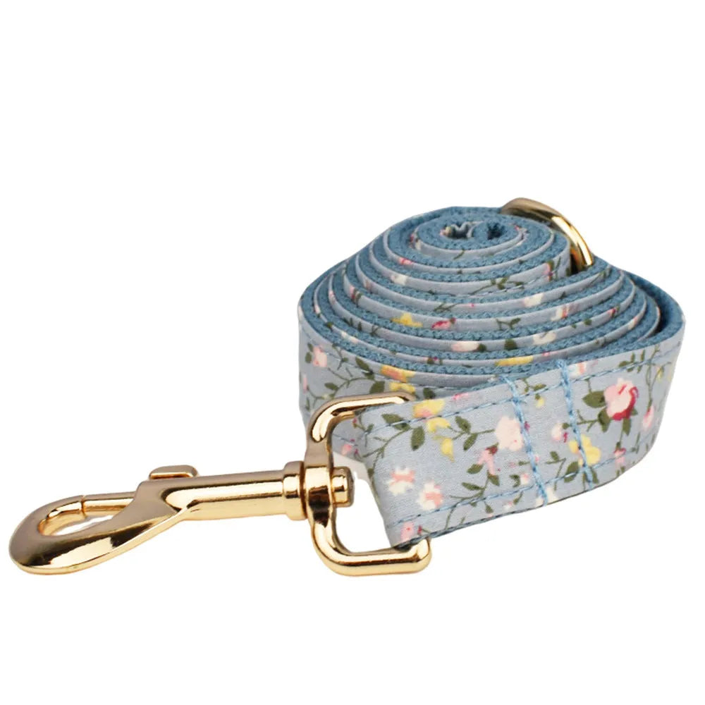 Blue floral polyester cotton dog collar with matching leash, bow tie, vest and poop bag holder set