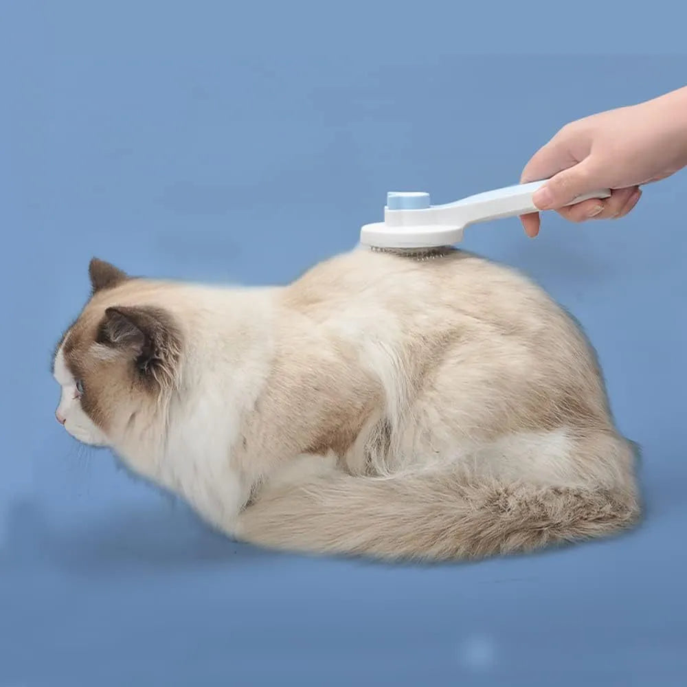 Blue self-cleaning pet brush with rubber handle and metal pins for removing loose cat and dog hair.