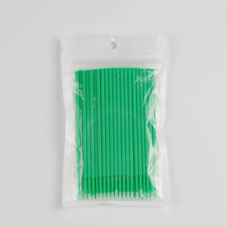 Disposable micro applicator brushes with bendable cotton tips and colour-coded handles for eyelash extensions