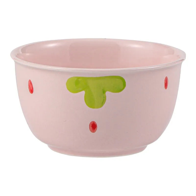 Porcelain dinnerware set with cute strawberry design showing straw hat plate, flower bowl, and twist spoon