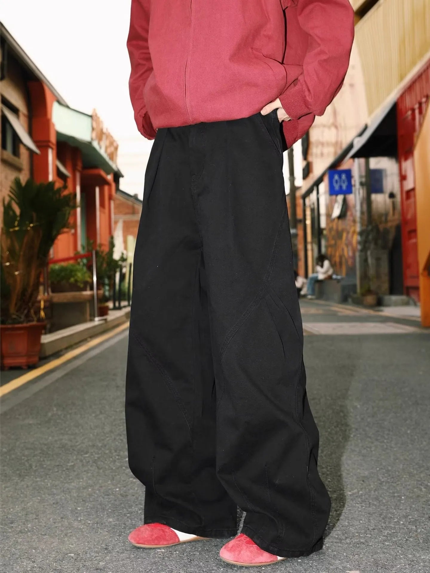 Men's apricot straight-leg loose fit trousers with elastic waist on a hanger.