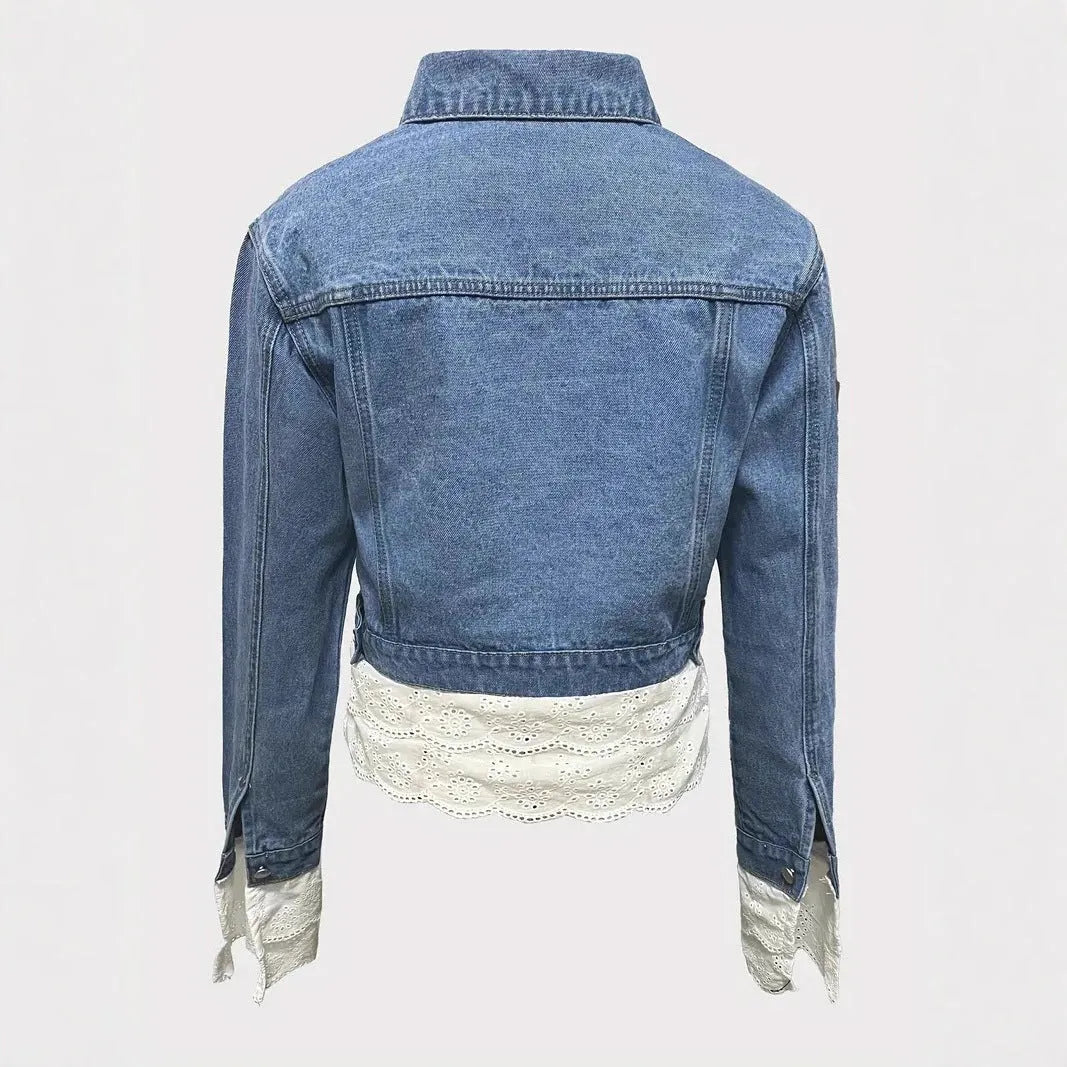 Blue women's denim jacket with lace stitching detail on front, long sleeves, shown on hanger
