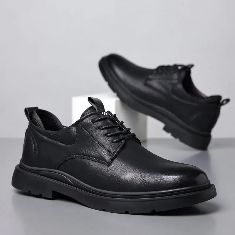 Men's black and brown breathable leather casual shoes with rubber sole and sewing line detail.