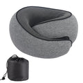 Black memory foam U-shaped travel neck pillow with a storage bag, shown for scale.