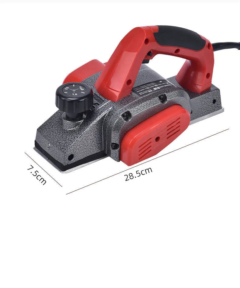 Red aluminium electric wood planer tool with 82mm cutting width on workbench