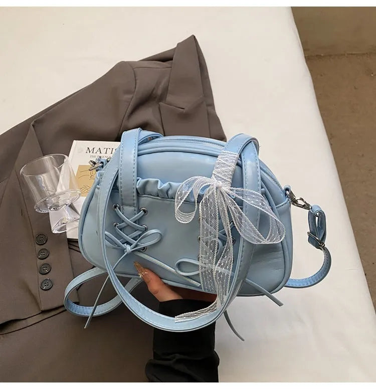 Ladies casual shoulder bag with bandage bow detail and internal mobile phone compartment