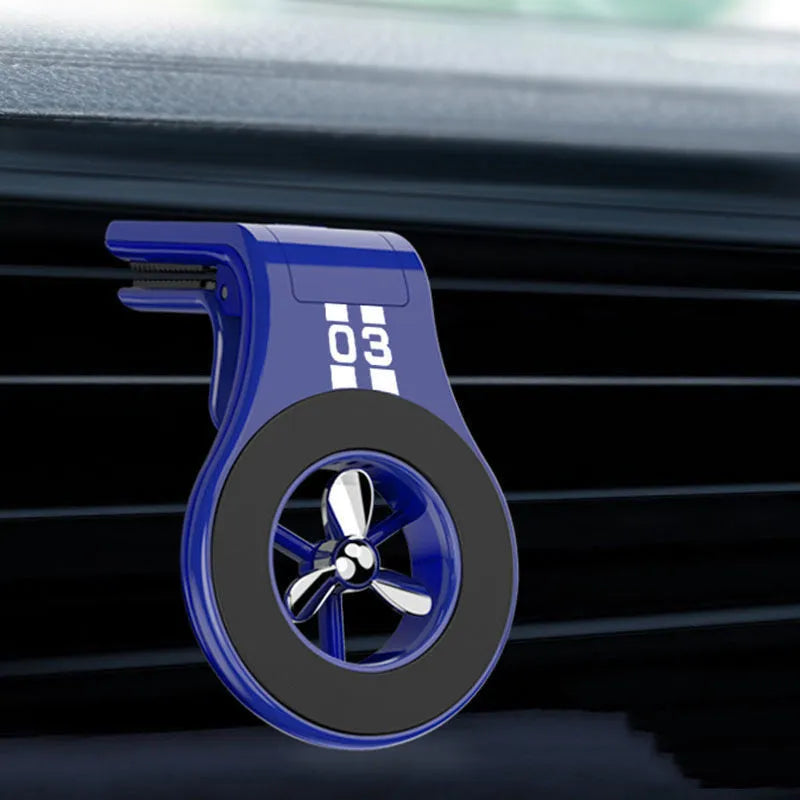 Magnetic car phone holder mounted on vehicle air vent with smartphone attached showing adjustable rotation mechanism