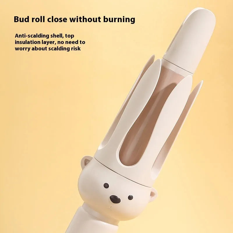 Beige anion automatic hair curler with UK plug on a styling wand.