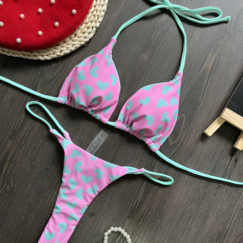 Backless one-piece swimsuit with heart print and split leg in nylon fabric.