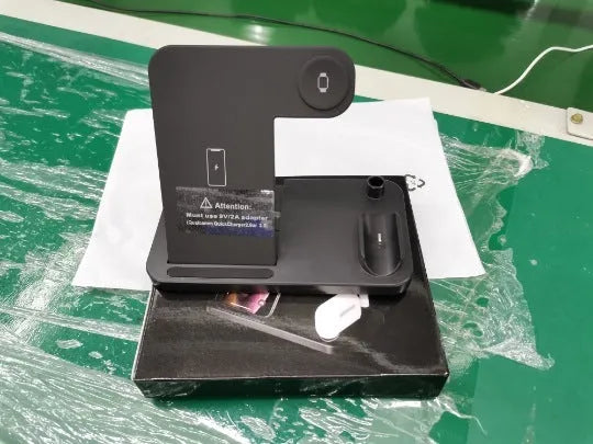 A folded 4-in-1 wireless charger for Apple devices in Space Grey, showing MagSafe pad and Apple Pencil slot.