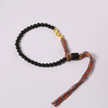 Hand-woven obsidian black wrist strap showing 4mm width and natural cord texture