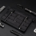Black Oxford cloth portable outdoor organiser kit measuring 18cm by 3.5cm