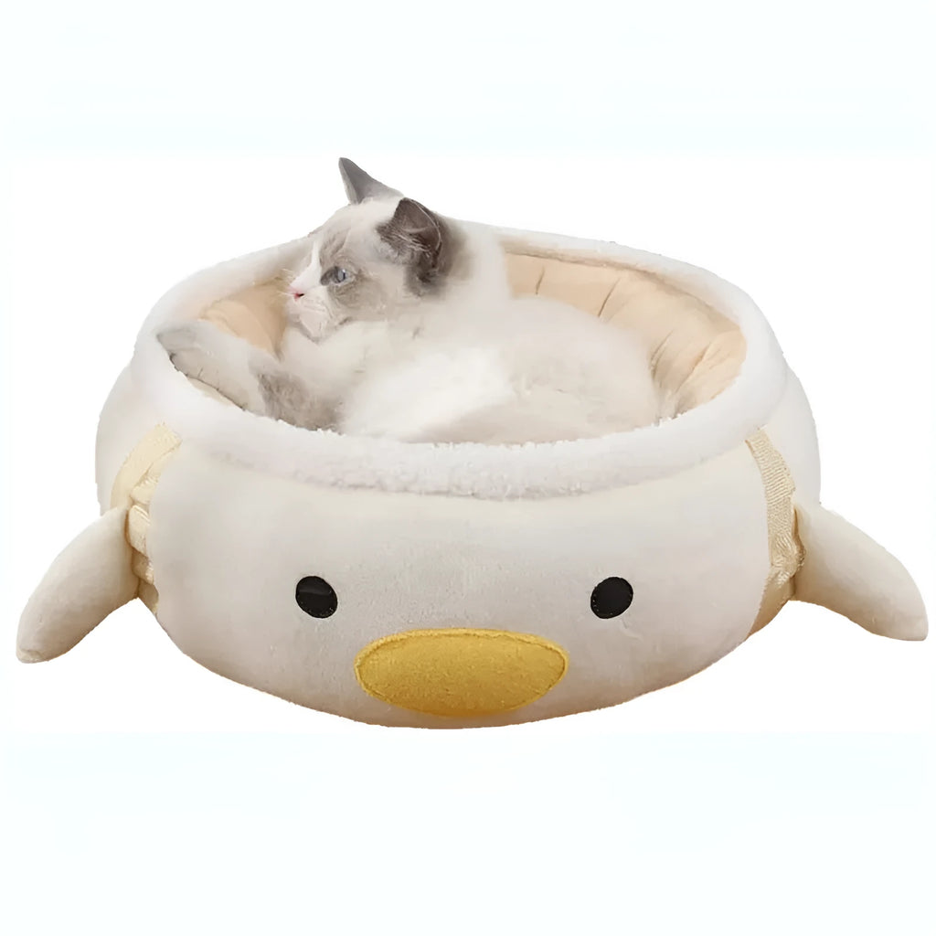 Green dinosaur-shaped cat bed shown both flat as a sofa and hanging as a hammock for small pets.