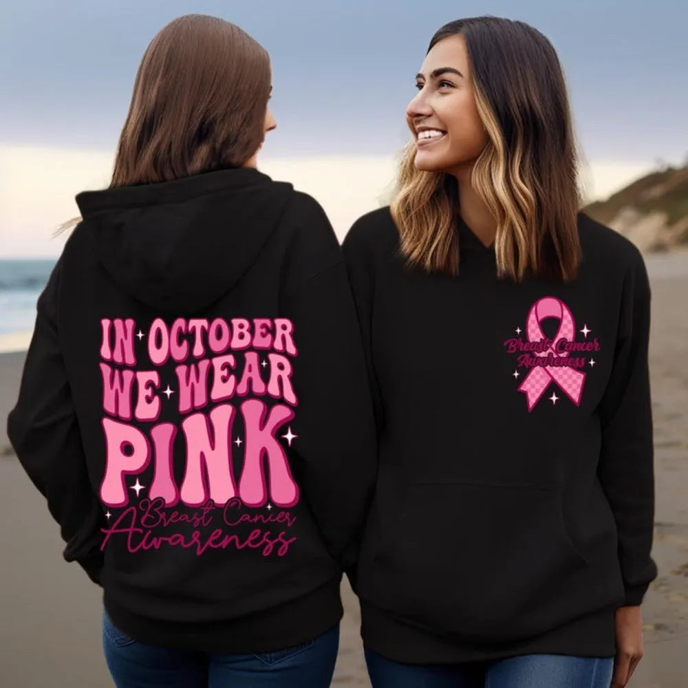 Breast cancer awareness pullover hoodie with retro art print in pink, featuring side seam pockets.