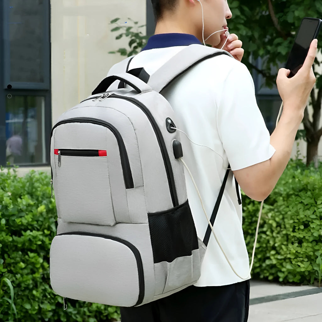 Light grey Oxford cloth picnic backpack with curved shoulder straps showing insulated compartments