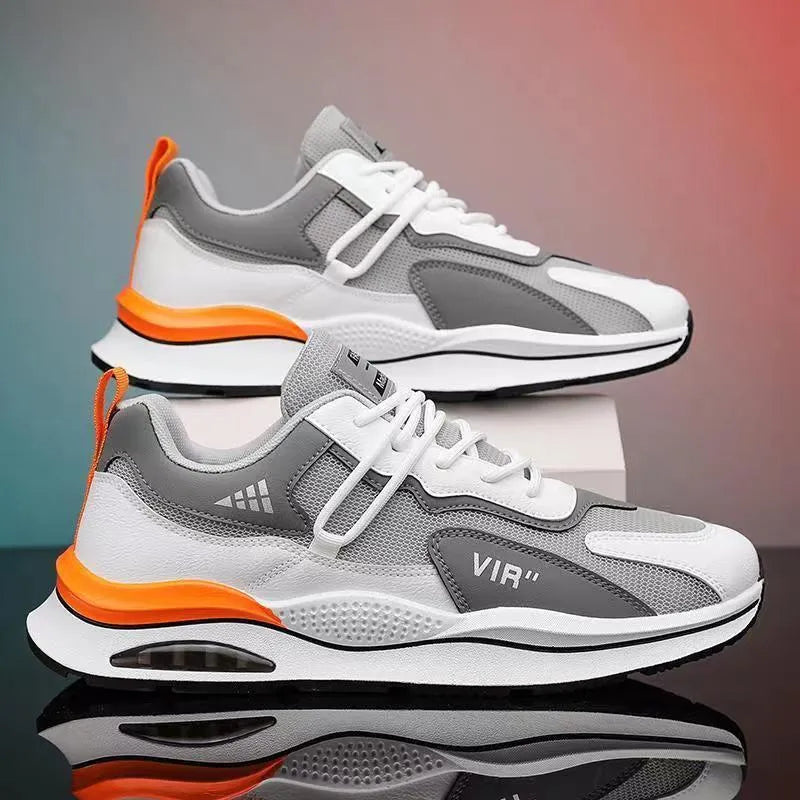 Men's grey mesh running shoes with mid-top height and rounded toe design on white background